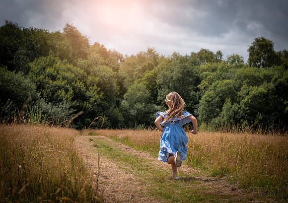 girl running into the sunset