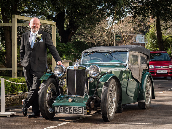 Groom with classic car at Green House Hotel